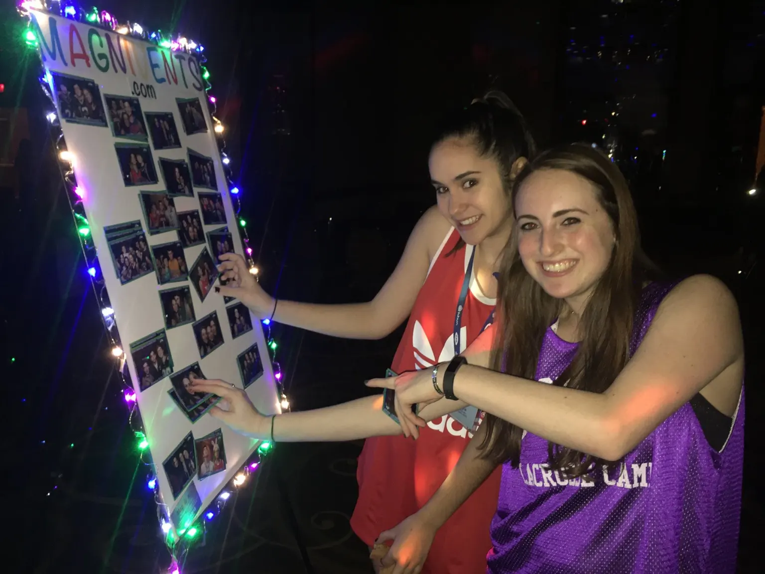 People grabbing photo magnets